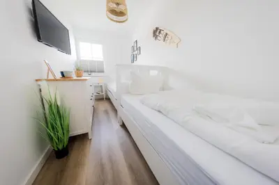 Ein Bett oder Betten in einem Zimmer der Unterkunft Haus Q Superior - Hälfte 1
