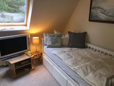 Ein Bett oder Betten in einem Zimmer der Unterkunft Ferienhaus Boddenblick mit Sauna
