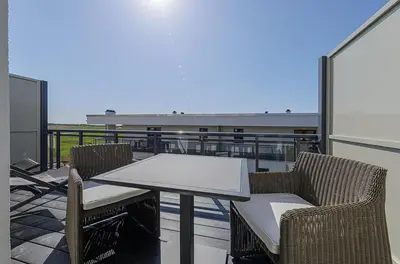 Ein Balkon oder eine Terrasse in der Unterkunft 5 Sterne Apartment Ostseedeck mit Westbalkon