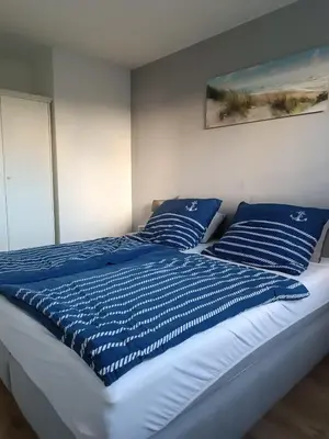 Ein Bett oder Betten in einem Zimmer der Unterkunft Ostseemeerchen