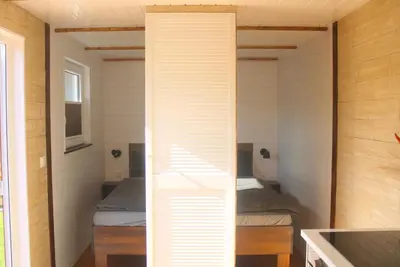 Ein Bett oder Betten in einem Zimmer der Unterkunft Ostsee Tiny Haus Spatz