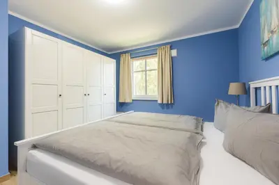 Ein Bett oder Betten in einem Zimmer der Unterkunft HMuschelsucher, Birkenstraße 7a, App 1