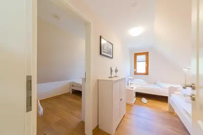 Ein Bett oder Betten in einem Zimmer der Unterkunft Doppelhaushälfte Wustrow