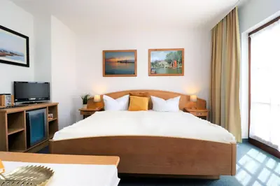 Ein Bett oder Betten in einem Zimmer der Unterkunft Deutsches Haus Zimmer 25