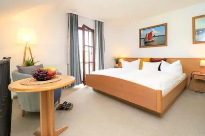 Ein Bett oder Betten in einem Zimmer der Unterkunft Deutsches Haus Zimmer 38