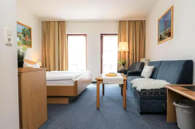 Ein Bett oder Betten in einem Zimmer der Unterkunft Deutsches Haus Zimmer 20