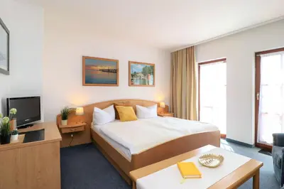Ein Bett oder Betten in einem Zimmer der Unterkunft Deutsches Haus Zimmer 20