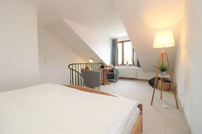 Ein Bett oder Betten in einem Zimmer der Unterkunft Deutsches Haus Zimmer 35