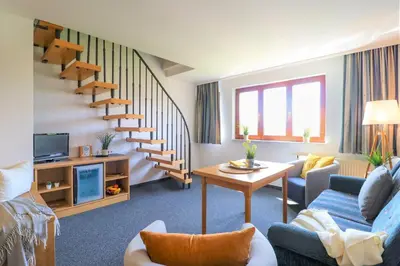 Ein Sitzbereich in der Unterkunft Deutsches Haus Zimmer 39