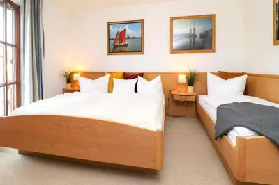Ein Bett oder Betten in einem Zimmer der Unterkunft Deutsches Haus Zimmer 39