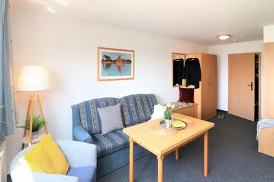 Ein Sitzbereich in der Unterkunft Deutsches Haus Zimmer 39