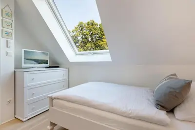 Ein Bett oder Betten in einem Zimmer der Unterkunft Portus