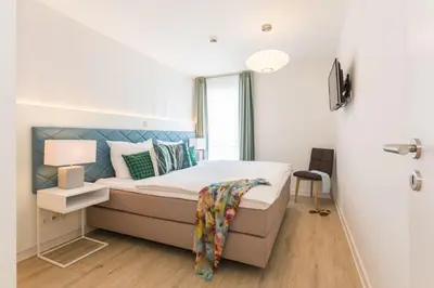 Ein Bett oder Betten in einem Zimmer der Unterkunft Am Park 21