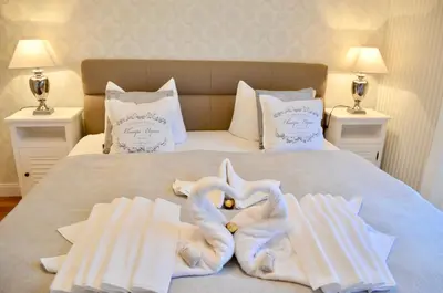 Ein Bett oder Betten in einem Zimmer der Unterkunft Villa Strandblick 7