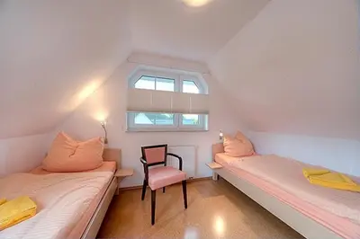 Ein Bett oder Betten in einem Zimmer der Unterkunft Strandglück FH 1