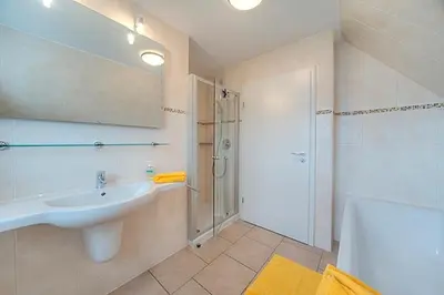 Ein Badezimmer in der Unterkunft Strandglück FH 1