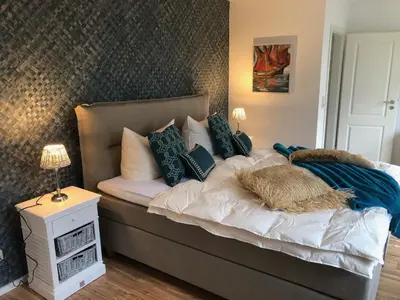 Ein Bett oder Betten in einem Zimmer der Unterkunft romantisches Ferienhaus Boddenblick mit Sauna