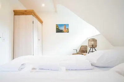 Ein Bett oder Betten in einem Zimmer der Unterkunft Traumgarten Haus Unschuld