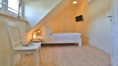 Ein Bett oder Betten in einem Zimmer der Unterkunft Heideröschen Park Heideröschen 5b