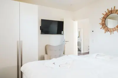 Ein Bett oder Betten in einem Zimmer der Unterkunft Dünenquartier Apartment 18