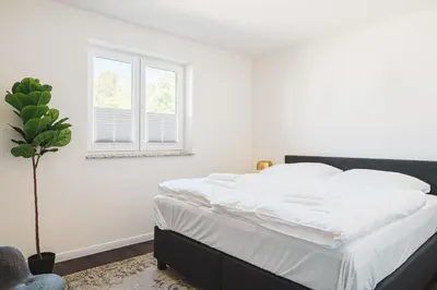 Ein Bett oder Betten in einem Zimmer der Unterkunft Dünenquartier Apartment 19