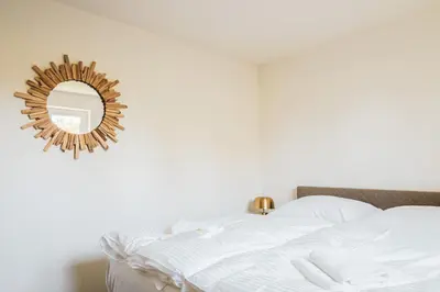 Ein Bett oder Betten in einem Zimmer der Unterkunft Dünenquartier Apartment 20