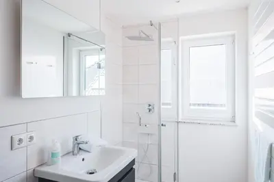 Ein Badezimmer in der Unterkunft Dünenquartier Apartment 21