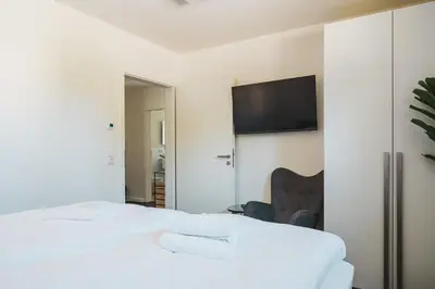 Ein Bett oder Betten in einem Zimmer der Unterkunft Dünenquartier Apartment 27