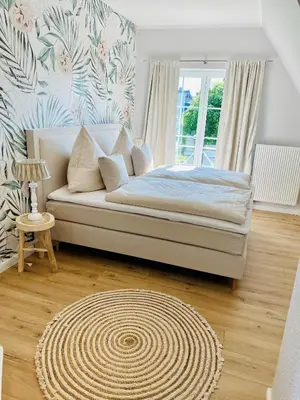 Ein Bett oder Betten in einem Zimmer der Unterkunft Strandhaus Luma