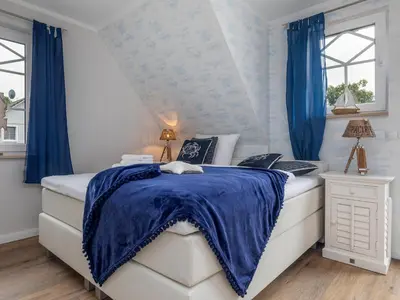 Ein Bett oder Betten in einem Zimmer der Unterkunft Haus Nordlicht