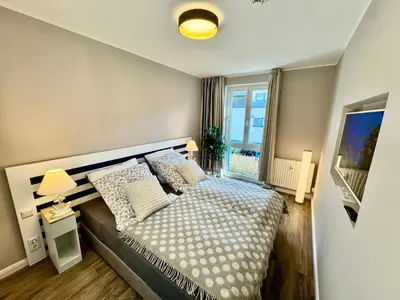 Ein Bett oder Betten in einem Zimmer der Unterkunft Ferienwohnung Nr 128 Zur Seebrucke