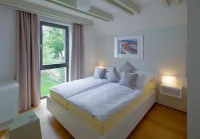 Ein Bett oder Betten in einem Zimmer der Unterkunft Domizil am Ostseewald - Seidelbast