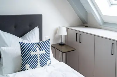 Ein Bett oder Betten in einem Zimmer der Unterkunft Dünenrose - Sauna, Kamin und waldnah