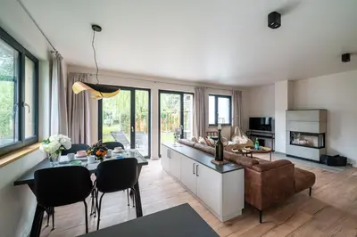 Küche/Küchenzeile in der Unterkunft Dünenrose - Sauna, Kamin und waldnah