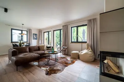 Ein Sitzbereich in der Unterkunft Haus Kornrade -5 Sterne mit Sauna & Kamin