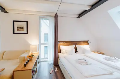 Ein Bett oder Betten in einem Zimmer der Unterkunft M2 Living Maisonette Apartment No 7